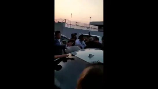 Shah Rukh Khan waving at fans while arrived at Ahmedabad airport