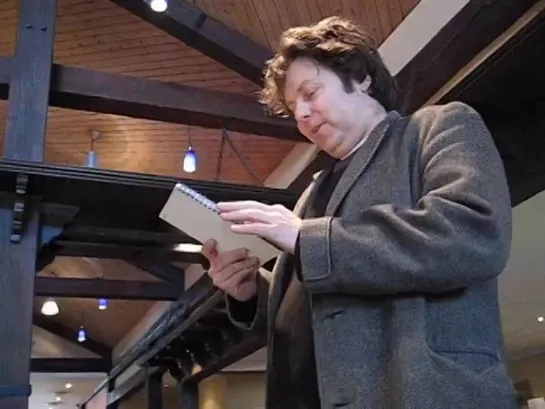 Rich reads the tour dates in a hotel reception