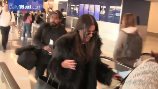 Lea Michele arrives at LAX full of chatter in her fur coat