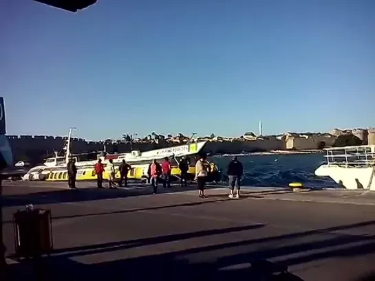 KING SARON catamaran fighting the waves with FLYING POSEIDON dolphin