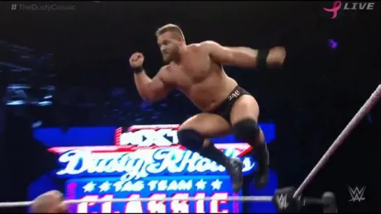 Backbreaker hold  / Diving elbow drop - The Mechanics (Scott Dawson and Dash Wilder)