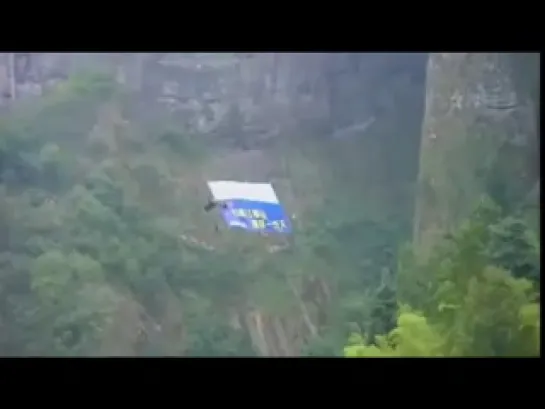 [RAW-HQ] Jeb Corliss- Daredevil Lands 'Flying Dagger' Jump Through Mountain Jianglang in China