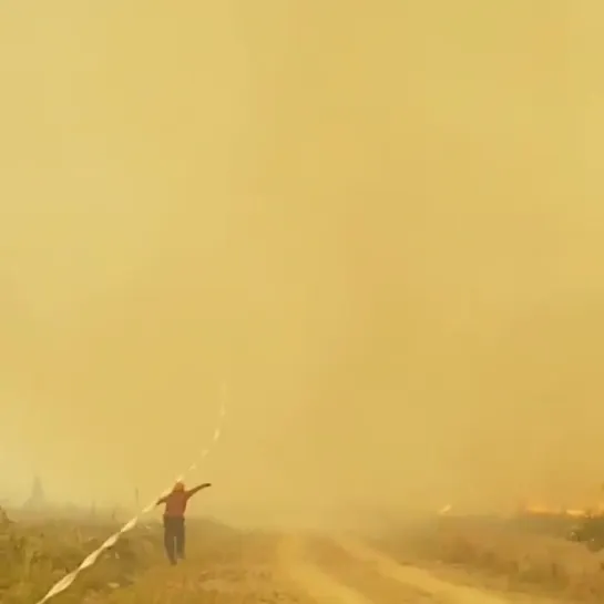 hose sucked in by fire tornado