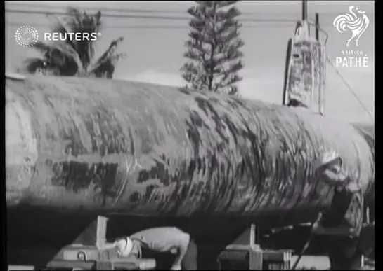 Navy engineers examine Japanese Type A Target midget submarine (1941)