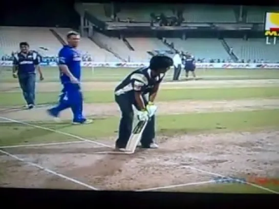 SRK playing cricket (flungs bat off)