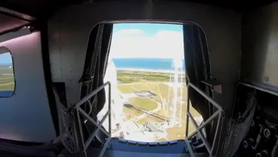 View of Launch Complex 39A and Crew Dragon from the crew access arm