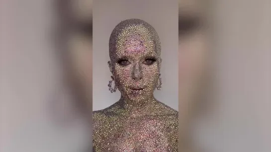 Make-up artist sticks 13,000 rhinestones to her face taking inspiration from Doja Cat   SWNS