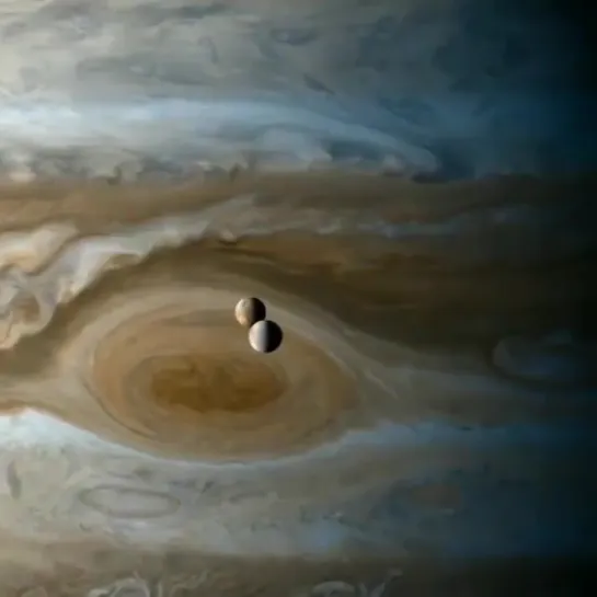 Jupiter's Moons Europa and lo over Jupiter's Great Red Spot.  Voyage of the Moons.