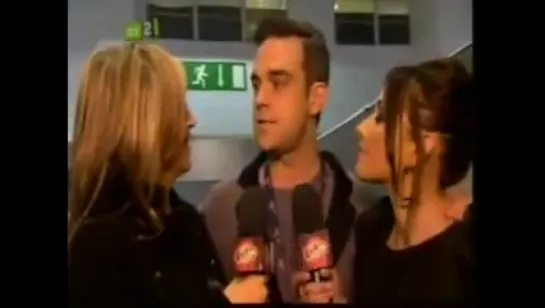 BRITs 2010 - Robbie Williams Backstage with Nicоle Appletone