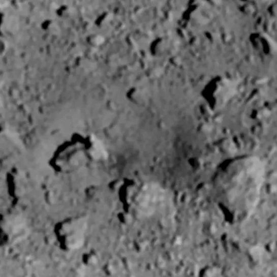 A before & after comparison image of the area where the impactor (SCI) hit the asteroid surface