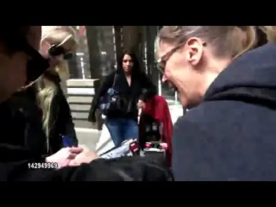 Taylor Momsen signs for a fan outside VH1 04/13/12