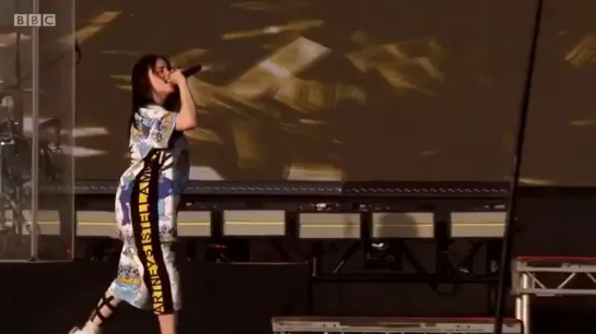 billie performing “bellyache” at glastonbury festival