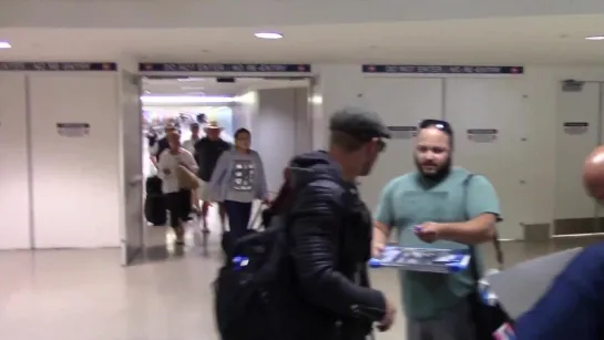 Kellan Lutz greets fans in a black leather jacket arriving at LAX Airport kellanlutz