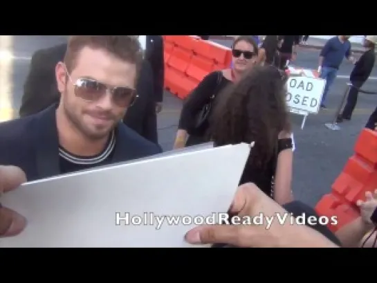 Kellan Lutz shows love to fans at the 2014 Young Hollywood Awards in LA