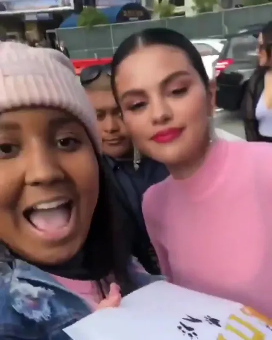 Selena with a fan