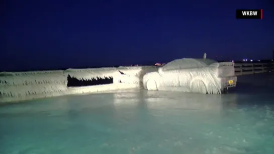 Car parked by Lake Erie is completely frozen