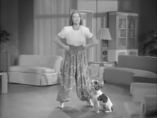 Eleanor Powell trained this dog herself and this scene was shot in her own living room