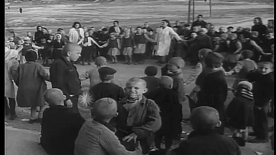 Yugoslavian boys and girls play outdoors at a school or orphanage HD Stock Footage