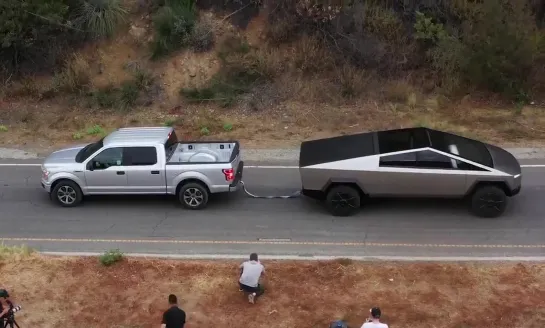 Cybertruck pulls F-150 uphill