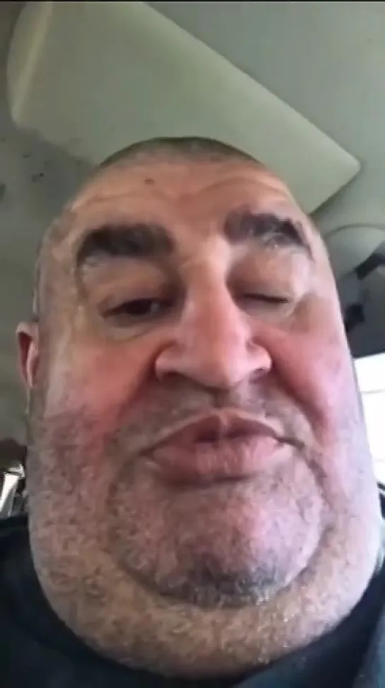 arab man sends a message to joe biden in his car