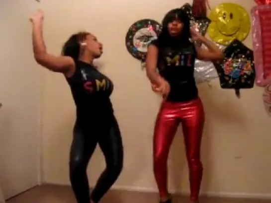 Two girl dance in shiny leggings