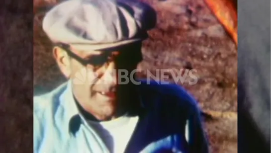 Vito Genovese in a jail yard wearing prison uniform