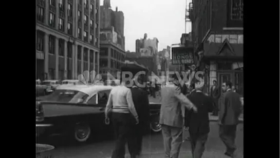 Vincent Gigante emerges from a building