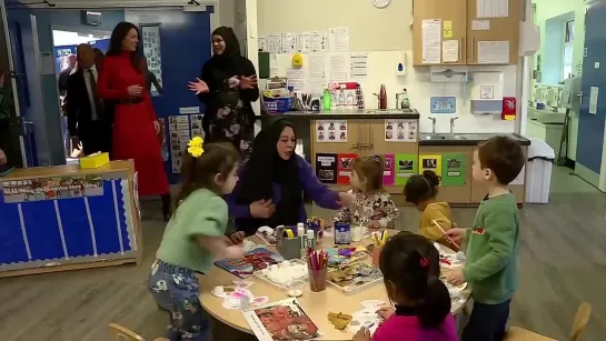 Kate plays with kids during nursery visit