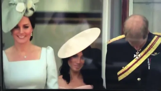 Kate, Meghan and Harry curtsying to the Queen on balcony of Buckingham Palace TroopingtheColour