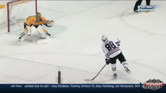 Patrick Kane snaps wicked shot by the glove of Rinne.